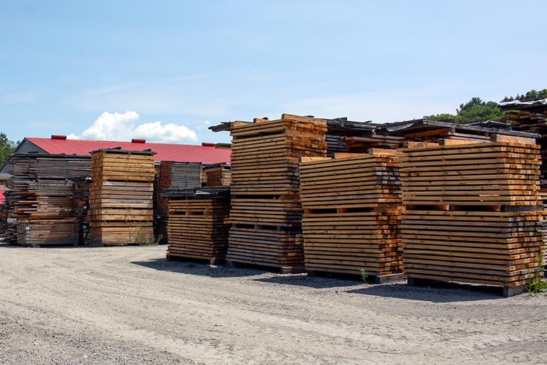 Stacks of lumber in yard